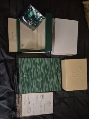 Rolex packaging set in green, cream and white